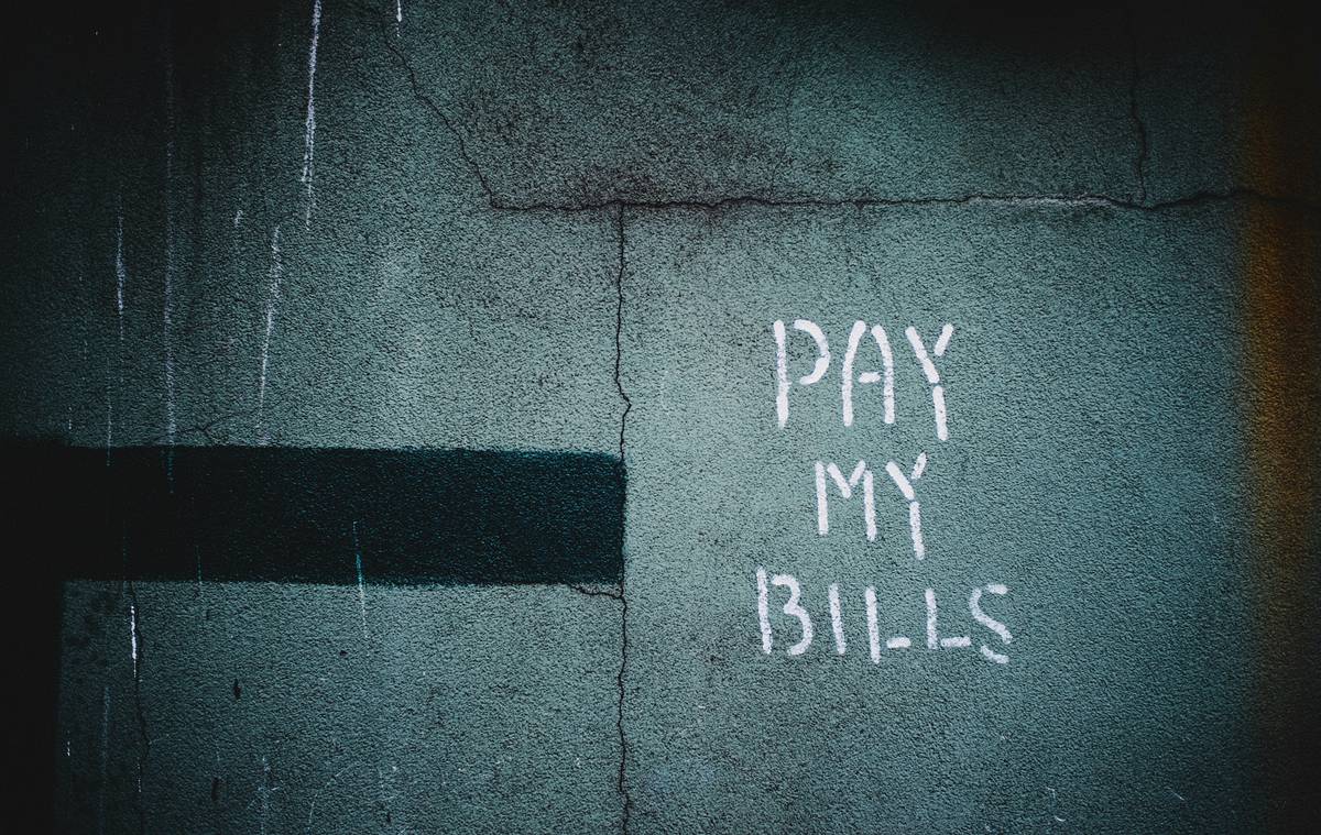 debt subscription cancellation bill showing highlighted recurring charges on a bank statement